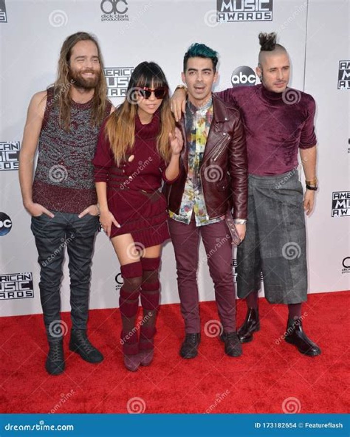 DNCE is an American pop band with Joe Jonas, Jack Lawless, Cole Whittle, JinJoo Lee-“imperfect awesome[ness] of the four of [them] together.”