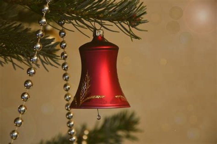 What do Christmas bells symbolize?